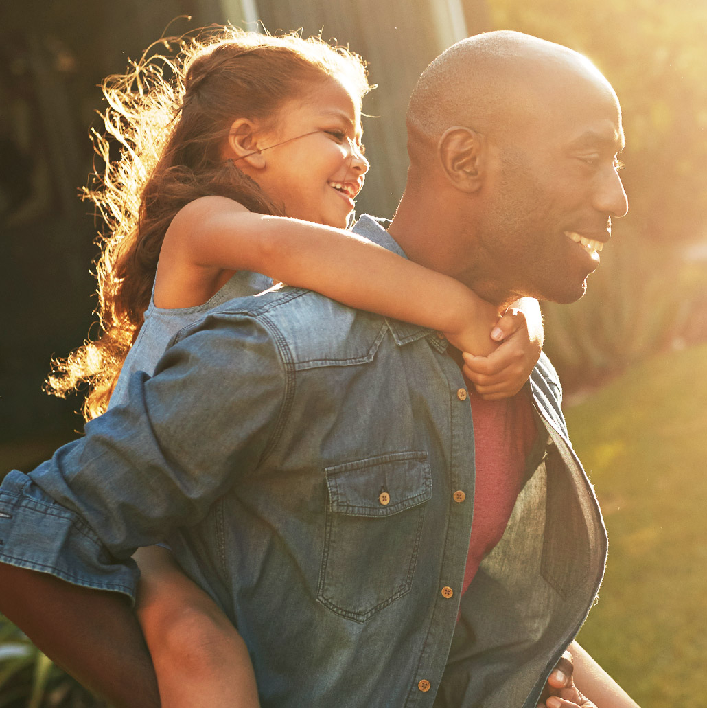 Man With Daughter On Shoulders